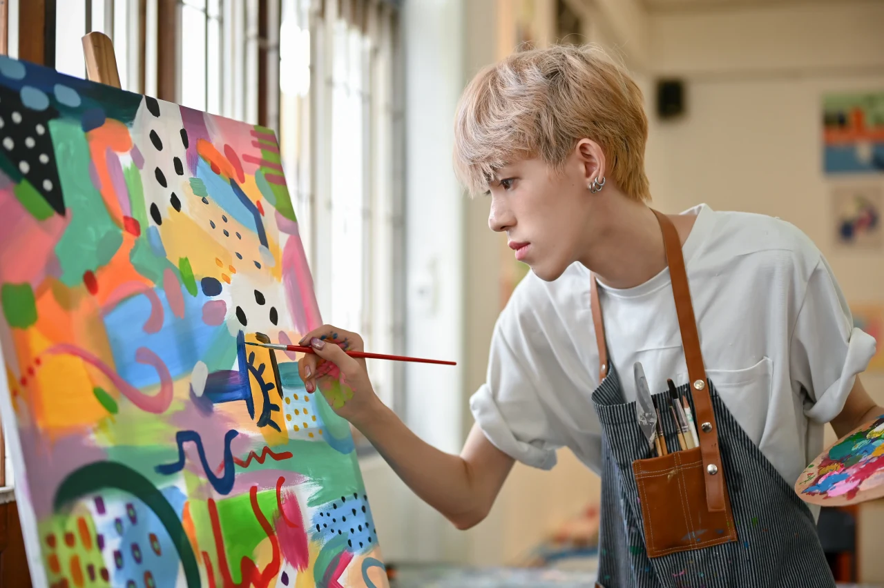 Artist painting on canvas