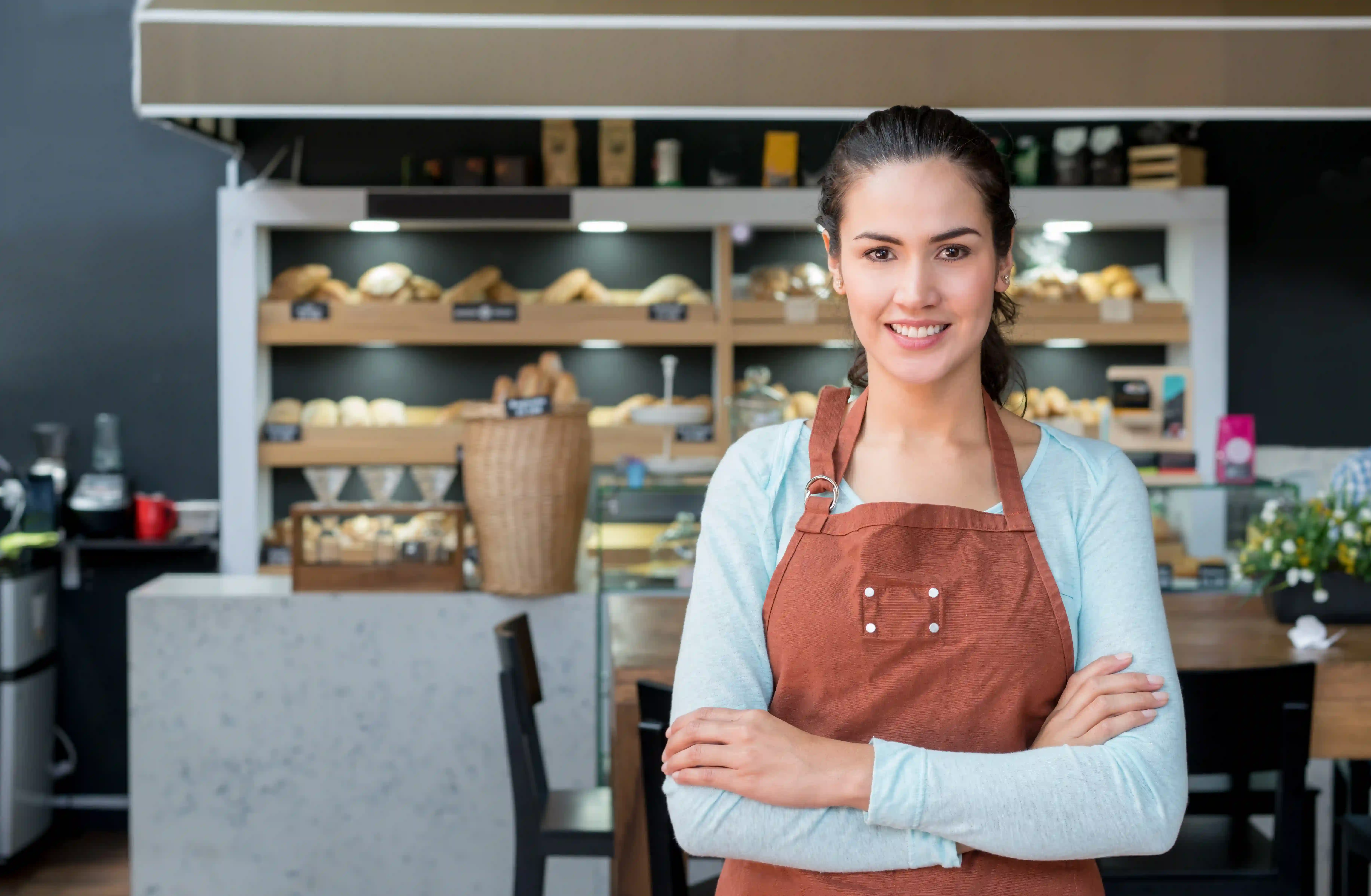 Business owner in a bakery with a digital gifting platform