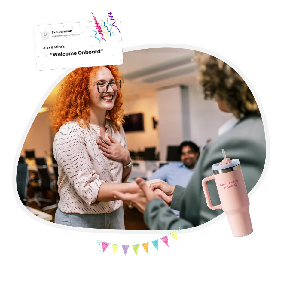 Team celebrating and welcoming a new employee with a gift 