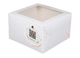 A white cake box with a scannable QR code sticker